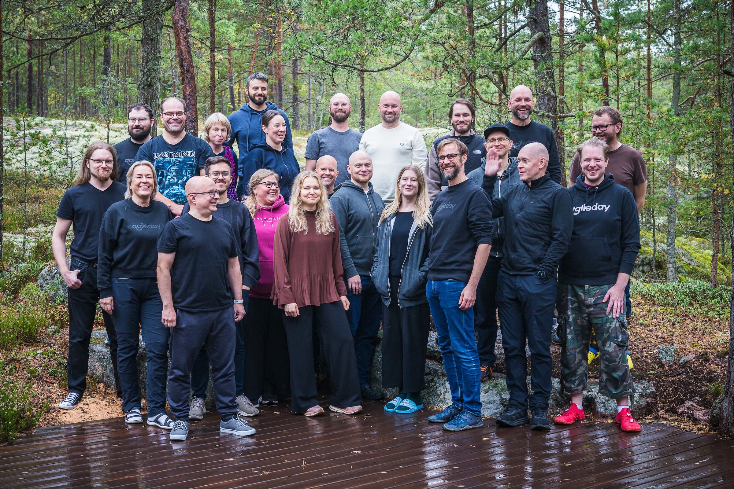 Members of the Agileday team at a company offsite in a pine forest